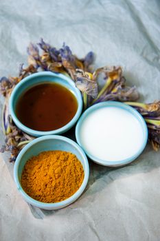 10 Home Remedies for Glowing Skin Three ceramic bowls with vibrant ingredients arranged on a rustic background.